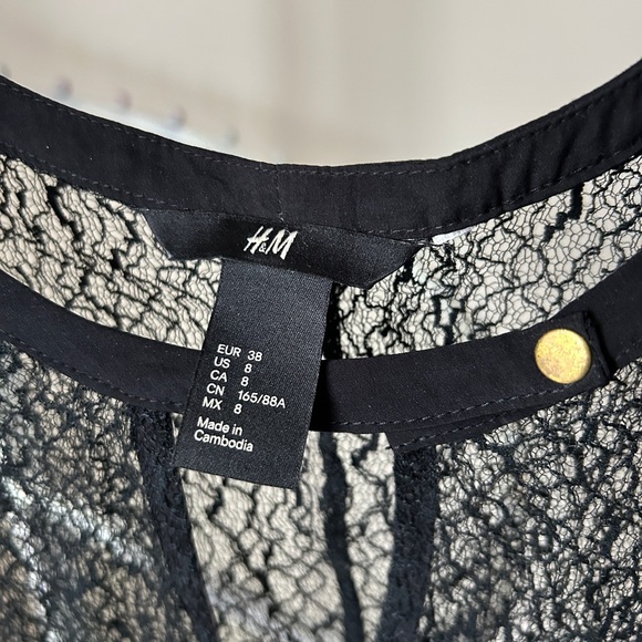 Sheer, textured black top with snap collar - Picture 2 of 5